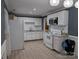 Well-lit kitchen features a stainless steel microwave, updated countertops, and subway tile backsplash at 4408 Pebblebrook Dr, Charlotte, NC 28208