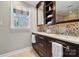 Elegant bathroom with double sinks, mosaic tile backsplash, and a bright window at 4811 Dawnridge Dr, Charlotte, NC 28226