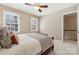 Bright bedroom features neutral walls, carpet, and a ceiling fan at 4811 Dawnridge Dr, Charlotte, NC 28226