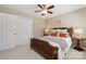 Well-lit bedroom features a large closet, ceiling fan, and comfortable bedding at 4811 Dawnridge Dr, Charlotte, NC 28226