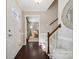 Inviting foyer with hardwood floors, staircase and a view of the living room for seamless transition at 4811 Dawnridge Dr, Charlotte, NC 28226