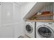 Convenient laundry room with modern machines and stylish wallpaper at 4811 Dawnridge Dr, Charlotte, NC 28226