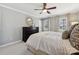 Comfortable main bedroom features neutral walls, large windows, and a ceiling fan at 4811 Dawnridge Dr, Charlotte, NC 28226