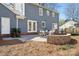 Backyard patio features stone pavers, a brick wall, and patio furniture at 4811 Dawnridge Dr, Charlotte, NC 28226