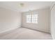 Bedroom features two windows and neutral color paint, creating a cozy and inviting atmosphere at 4918 Sarah Hall Ln, Charlotte, NC 28270