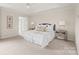 Bright bedroom with neutral decor, offering a tranquil and inviting atmosphere with ensuite bath access at 4918 Sarah Hall Ln, Charlotte, NC 28270