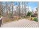 Relaxing outdoor deck surrounded by nature and overlooking the backyard at 4918 Sarah Hall Ln, Charlotte, NC 28270