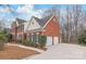 Charming brick home with a two-car garage, lush landscaping, and well-maintained curb appeal at 4918 Sarah Hall Ln, Charlotte, NC 28270