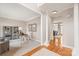 Inviting entryway featuring hardwood floors, a view into the living spaces, and stylish decor accents and a view into the office at 4918 Sarah Hall Ln, Charlotte, NC 28270