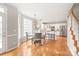 Bright kitchen features stainless steel appliances, white cabinets, granite counters, and an adjacent dining area with large windows at 4918 Sarah Hall Ln, Charlotte, NC 28270