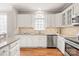 Open-concept kitchen with a view of the dining area and living room at 4918 Sarah Hall Ln, Charlotte, NC 28270