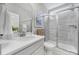 Bright bathroom featuring a glass-enclosed shower, a marble vanity, and modern fixtures at 5158 Mill Creek Rd, Clover, SC 29710