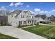 Beautiful two-story home with a manicured lawn and inviting front porch at 5158 Mill Creek Rd, Clover, SC 29710