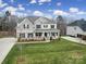 Exterior aerial shot of a home with a manicured front lawn and inviting front porch at 5158 Mill Creek Rd, Clover, SC 29710