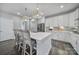 Bright kitchen featuring a large center island with seating and pendant lighting at 5158 Mill Creek Rd, Clover, SC 29710