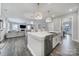 Modern kitchen with stainless steel sink and appliances that seamlessly flows into living space at 5158 Mill Creek Rd, Clover, SC 29710