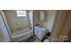 A quaint bathroom with a tub and vanity at 525 S Trenton St, Gastonia, NC 28052