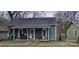 Quaint single-story home with a covered front porch and an overgrown lawn, ready for renovation at 525 S Trenton St, Gastonia, NC 28052