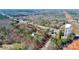 Aerial view of a wooded lot outlined in red with home, road access, and water tower nearby at 5369 Concord Rd, York, SC 29745