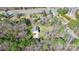 An aerial view of a house nestled in a wooded area near a road and a water tower at 5369 Concord Rd, York, SC 29745