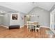 Bright dining area with hardwood floors, bench seating, and views to the kitchen at 5369 Concord Rd, York, SC 29745