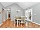 Bright dining area with hardwood floors, a modern light fixture, and access to the deck at 5369 Concord Rd, York, SC 29745