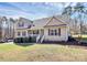Lovely home showcasing a welcoming front porch, neat shrubs, and green lawn at 5369 Concord Rd, York, SC 29745