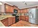 Well-lit kitchen with stainless steel appliances, granite countertops and hardwood floors at 5369 Concord Rd, York, SC 29745