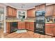 View of kitchen with granite countertops, stainless steel appliances and hardwood floors at 5369 Concord Rd, York, SC 29745