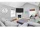 Cozy living room featuring a fireplace, large windows, and hardwood floors at 5369 Concord Rd, York, SC 29745