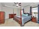 Spacious main bedroom with tray ceiling, hardwood furniture, and carpeted floor at 5369 Concord Rd, York, SC 29745