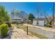 Expansive backyard with shed, playhouse, and wooden deck, perfect for outdoor entertaining at 60 Central Ave, Gastonia, NC 28054