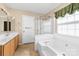 Bathroom featuring a walk-in shower and garden tub at 6311 Gold Dust Ct, Charlotte, NC 28269