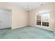 Bright bedroom featuring neutral walls, carpet, and a chandelier at 6311 Gold Dust Ct, Charlotte, NC 28269