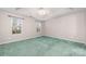 Spacious bedroom with natural light, tray ceiling, and ceiling fan at 6311 Gold Dust Ct, Charlotte, NC 28269