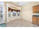 The breakfast nook has tile floors, natural light, and chandelier at 6311 Gold Dust Ct, Charlotte, NC 28269