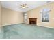 Living room with fireplace, natural light, and carpet at 6311 Gold Dust Ct, Charlotte, NC 28269