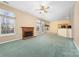 Living room featuring a fireplace and open floor plan at 6311 Gold Dust Ct, Charlotte, NC 28269