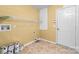 The utility room has tile flooring, storage shelves, and neutral walls at 6311 Gold Dust Ct, Charlotte, NC 28269