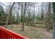 View of the backyard and fence from the large outdoor wooden deck at 6415 Santa Cruz Trl # 11, Charlotte, NC 28227