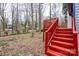 Exterior shot showing the stairway leading up to the spacious wooden deck at 6415 Santa Cruz Trl # 11, Charlotte, NC 28227