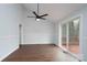 Dining room boasts wood floors, natural light, and a sliding glass door to a deck at 6415 Santa Cruz Trl # 11, Charlotte, NC 28227