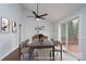 Light-filled dining room with neutral decor, a view to the deck, and stylish furnishings at 6415 Santa Cruz Trl # 11, Charlotte, NC 28227