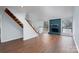 Bright living room featuring wood floors, a cozy fireplace, and plenty of natural light at 6415 Santa Cruz Trl # 11, Charlotte, NC 28227