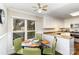 Bright breakfast nook with round glass table, seating for four, and adjacent kitchen space at 7305 Park Vista Cir, Charlotte, NC 28226