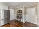 Dining area featuring hardwood floors and modern wine storage at 7305 Park Vista Cir, Charlotte, NC 28226