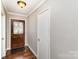 Entryway with decorative wooden front door and hardwood flooring at 7305 Park Vista Cir, Charlotte, NC 28226