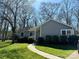 Inviting single-story home with a lush green lawn and charming walkway at 7305 Park Vista Cir, Charlotte, NC 28226