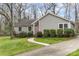 Charming single-story home with a well-manicured lawn and inviting walkway at 7305 Park Vista Cir, Charlotte, NC 28226