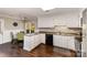 Spacious kitchen showcasing white cabinets, modern appliances, and sleek countertops at 7305 Park Vista Cir, Charlotte, NC 28226